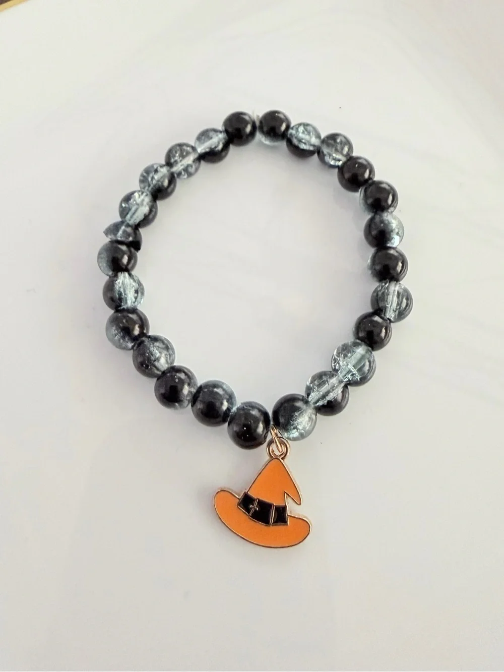 Black & Silver Beaded Bracelet with Orange Witch Hat Charm